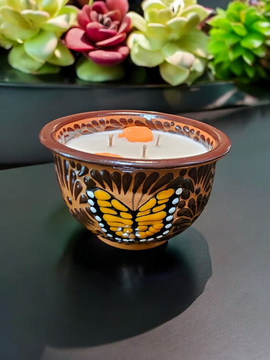The Vela Lady handcrafted brown Talavera salsa bowl candle featuring a hand-painted butterfly design and soy wax.