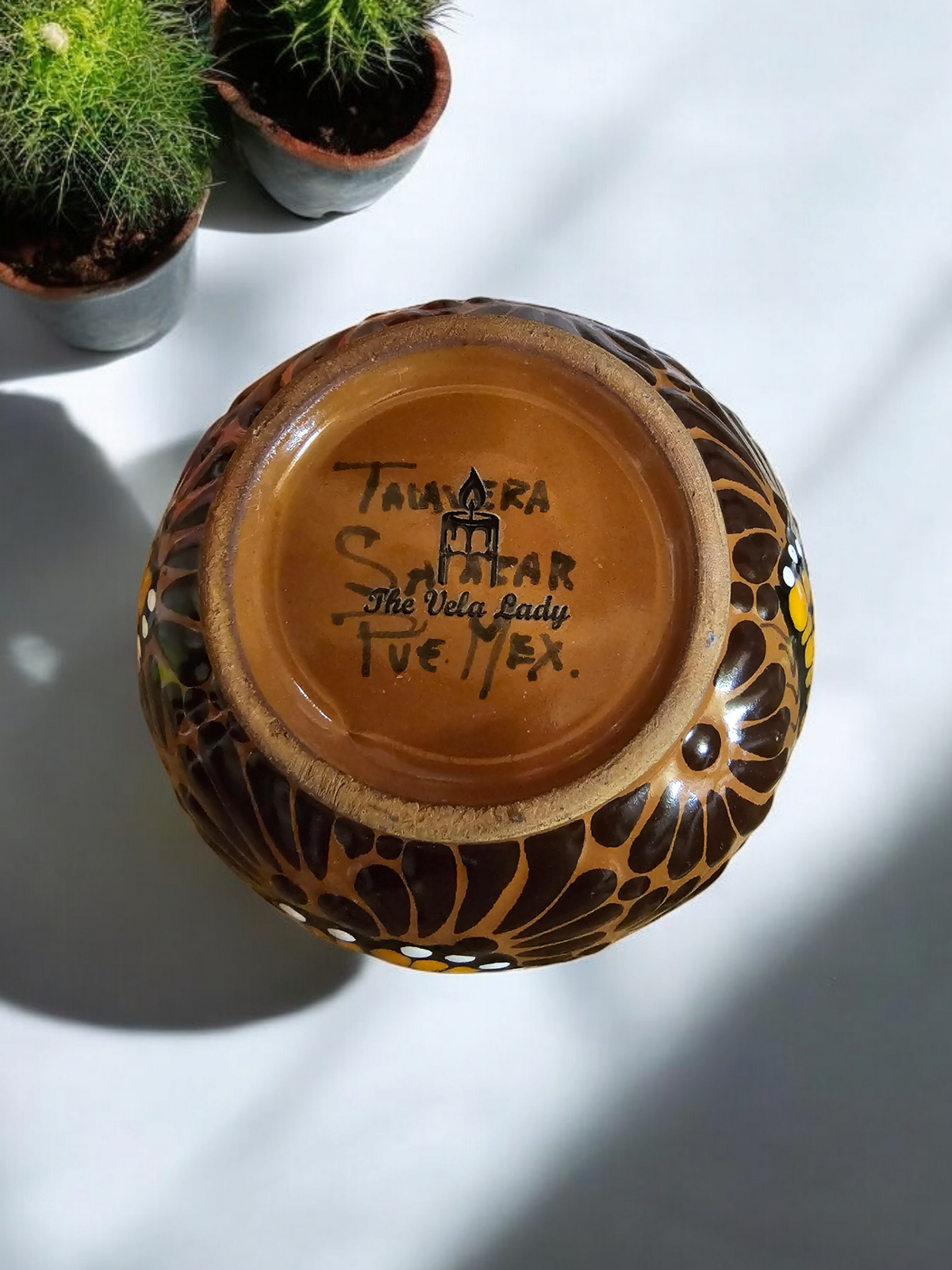 The Vela Lady handcrafted brown Talavera salsa bowl candle base with artist signature and butterfly pattern