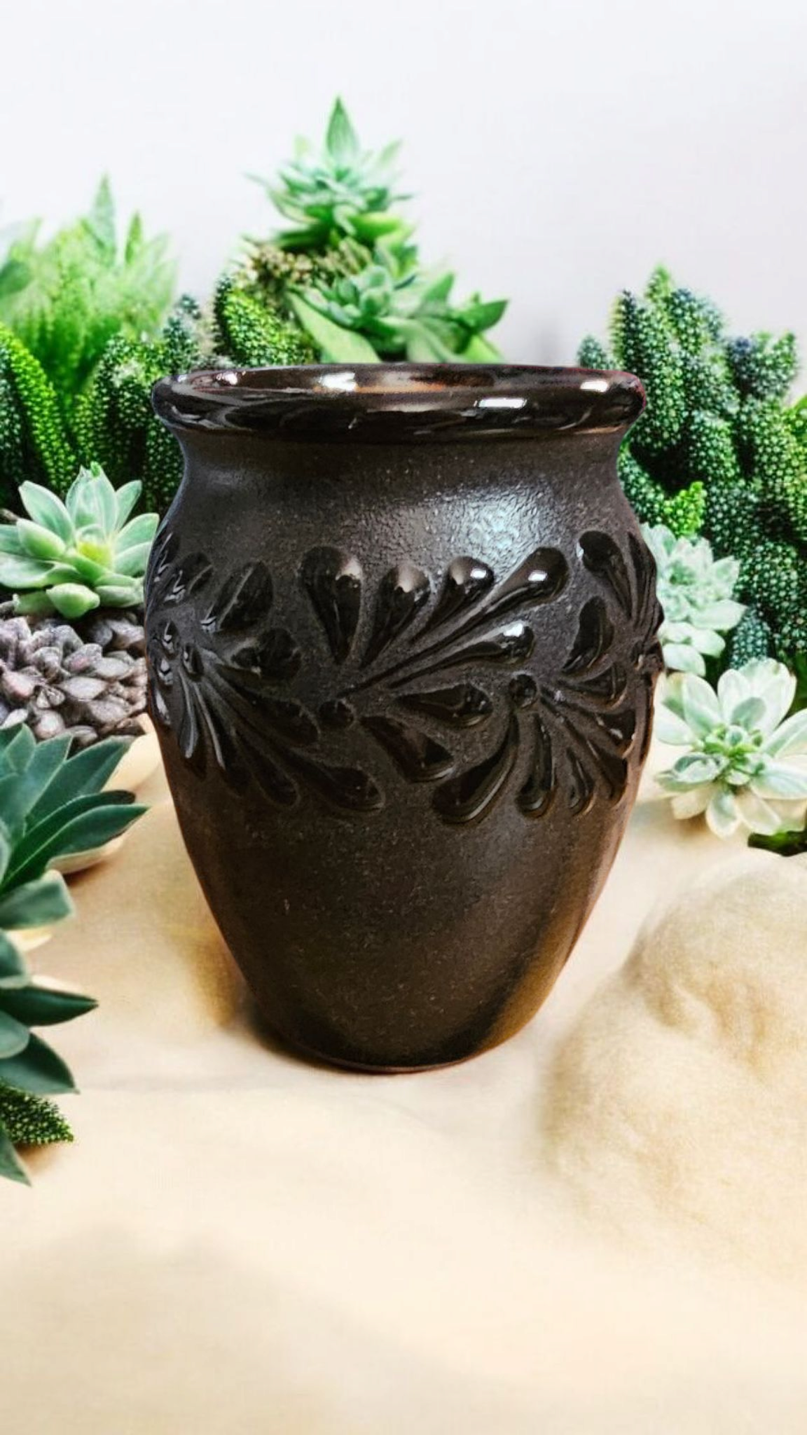 The Vela Lady Papacito Collection black handmade Mexican barro jarrito candle vessel with embossed leaf pattern