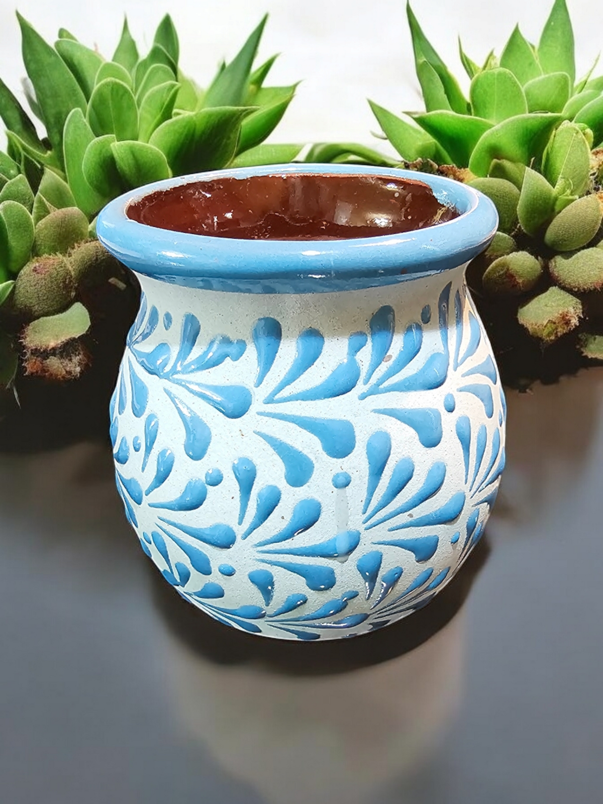 The Vela Lady blue and white hand-painted Mexican barro mug candle with intricate floral patterns