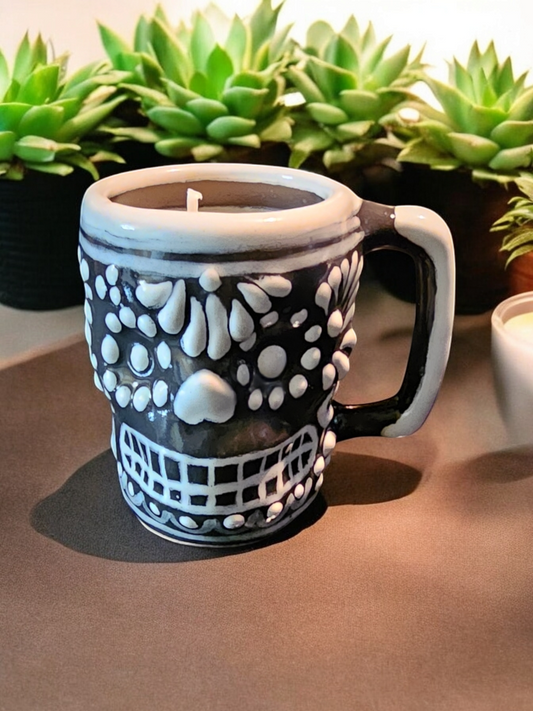 The Vela Lady Calavera shot glass candle in black and white Mexican Talavera ceramic with a skull design.