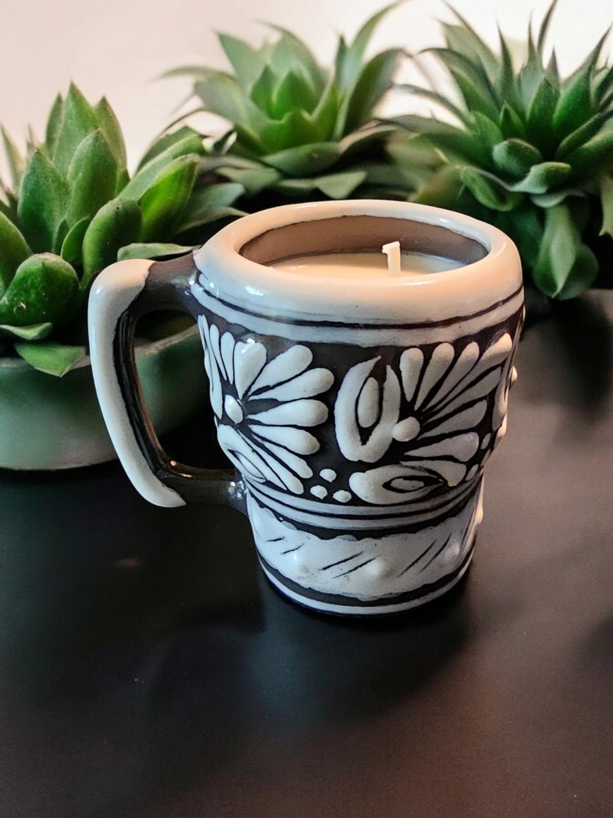 The Vela Lady Calavera shot glass soy candle in black and white hand-painted Mexican Talavera ceramic