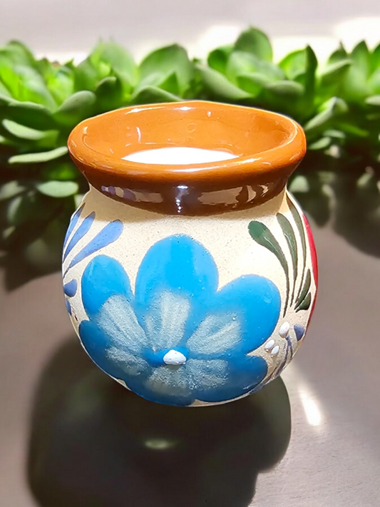 The Vela Lady handmade Mexican barro tazita shot candle with hand-painted blue floral design and soy wax