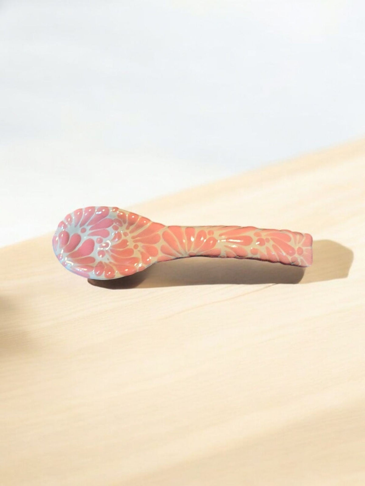 The Vela Lady handcrafted pink and white Talavera ceramic spoon with intricate floral patterns