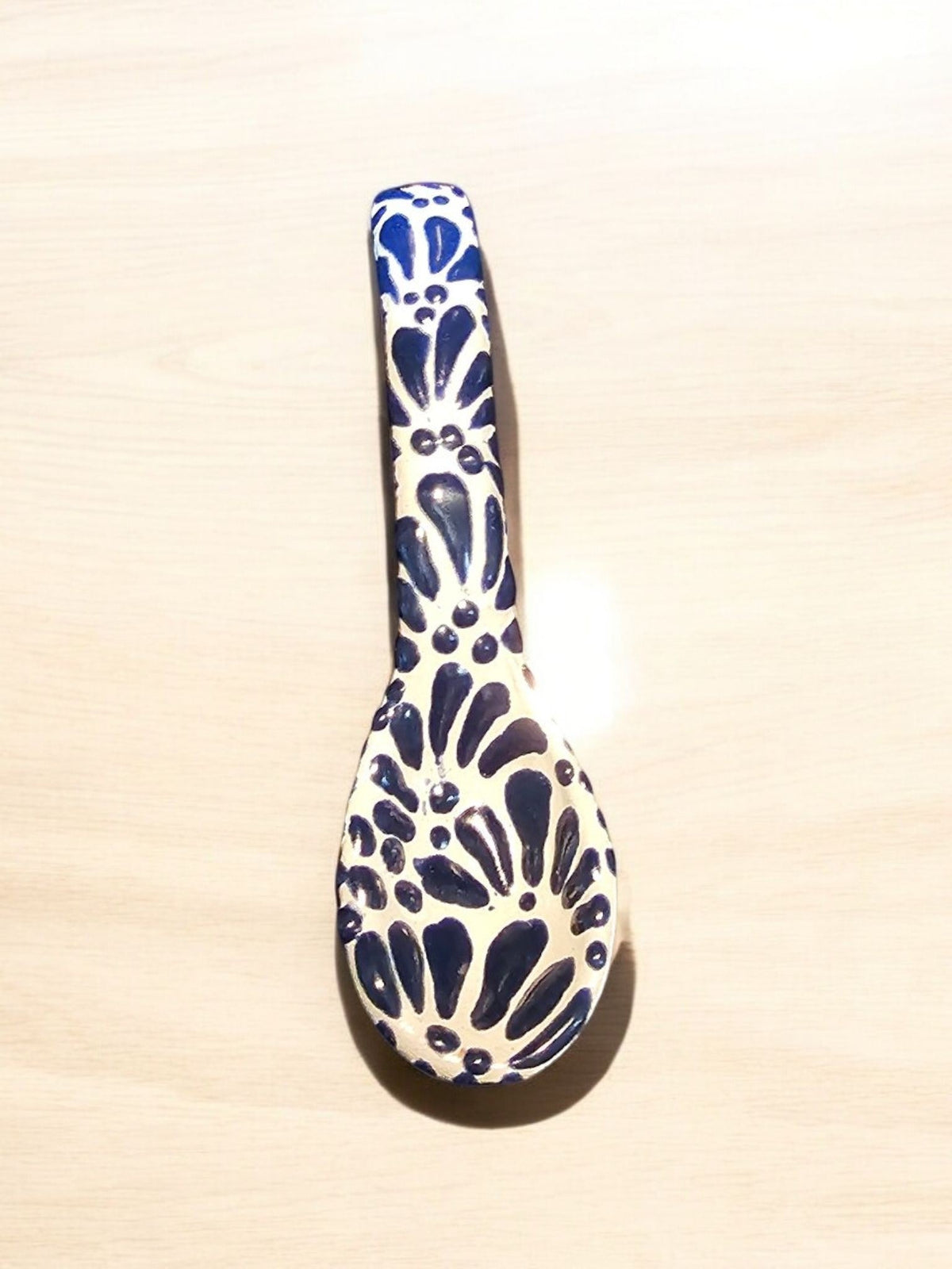 The Vela Lady handcrafted blue and white Talavera barro ceramic spoon with intricate floral patterns